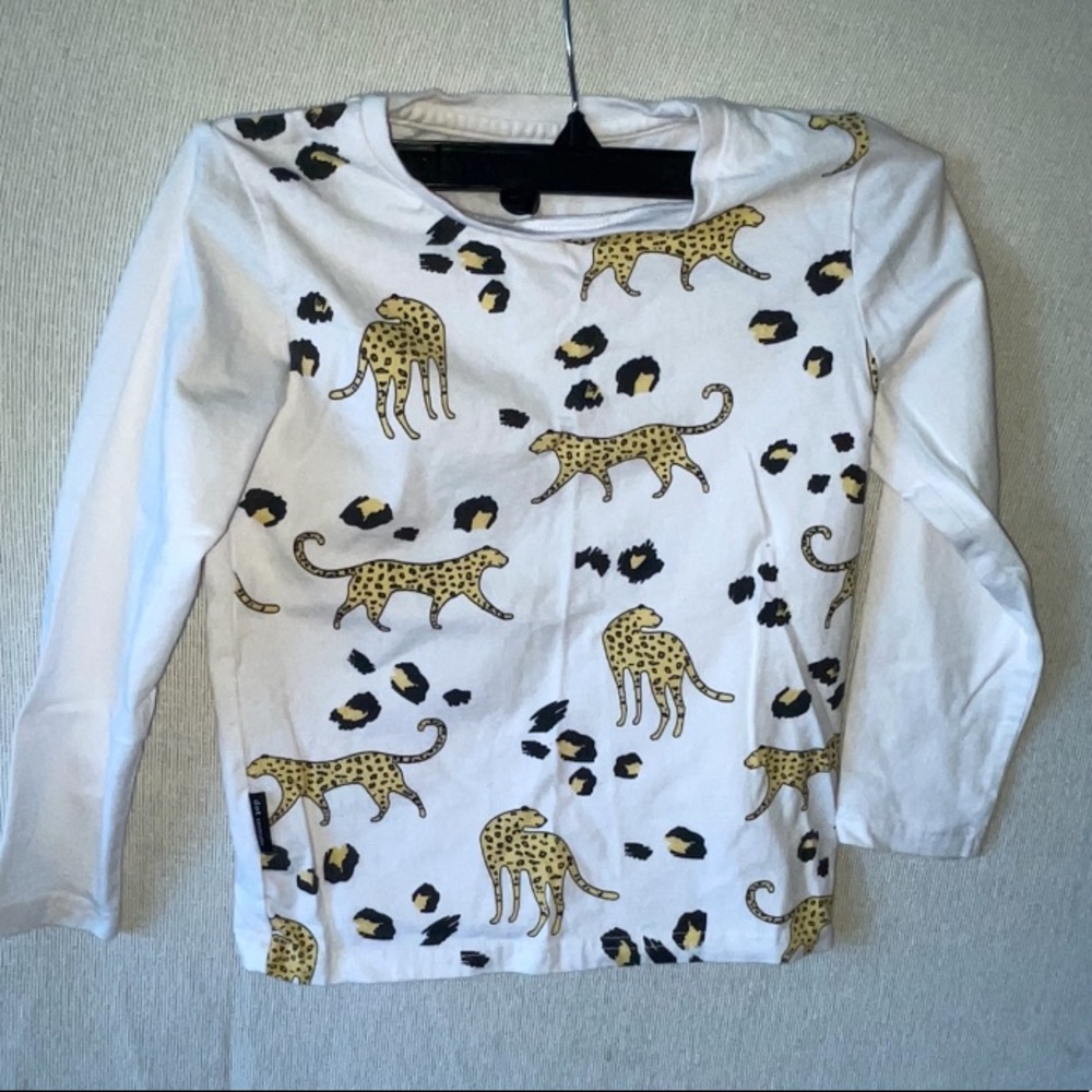 White shirt with leopards printed on front